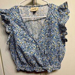 Floral sleeveless top with shoulder ruffles